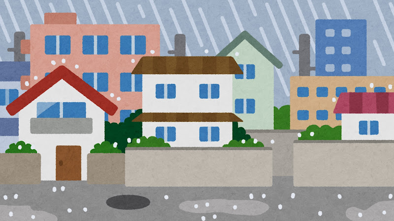 雨に打たれる住宅